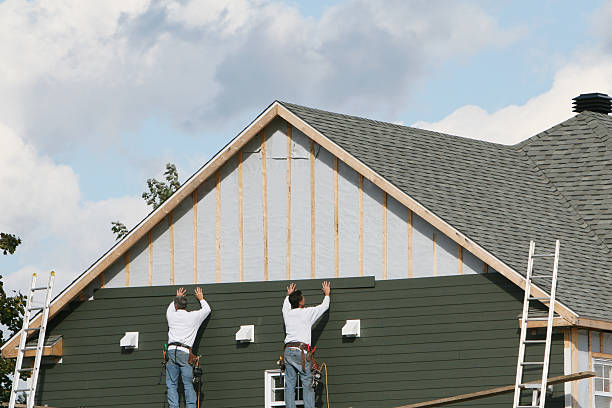 Professional Storm Damage Siding Repair technician working in Pleasantville, PA